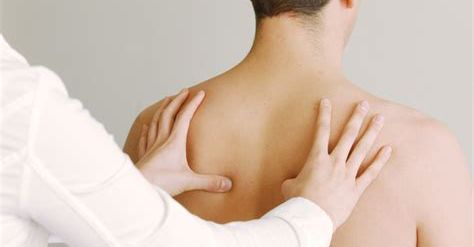 Doctor treating patient.